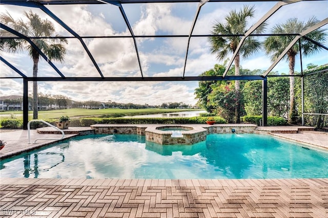 view of pool featuring a patio area, a lanai, and a pool with connected hot tub