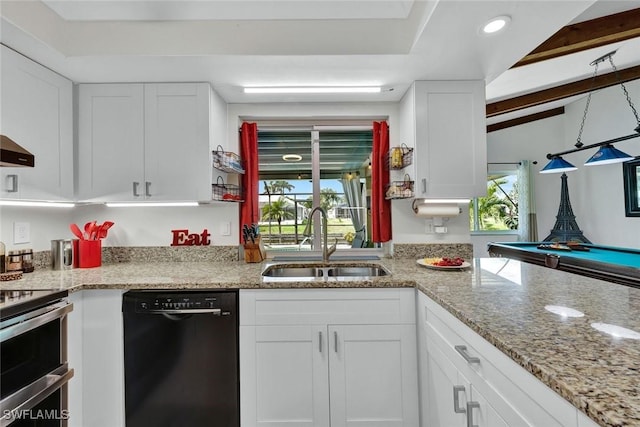 kitchen with black dishwasher, light stone counters, double oven range, white cabinetry, and a sink