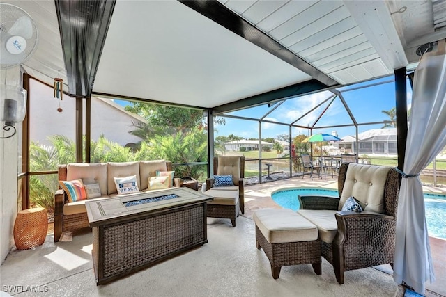 sunroom with plenty of natural light and beam ceiling