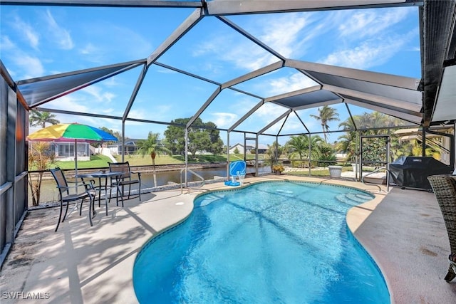 outdoor pool with a patio, grilling area, and a lanai