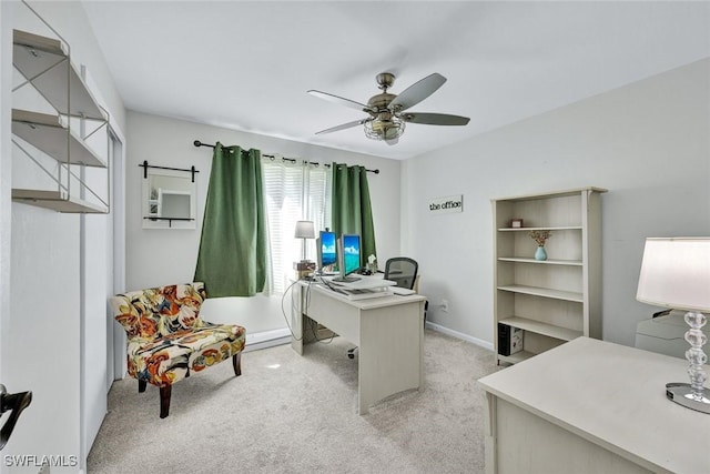 office featuring light carpet and ceiling fan