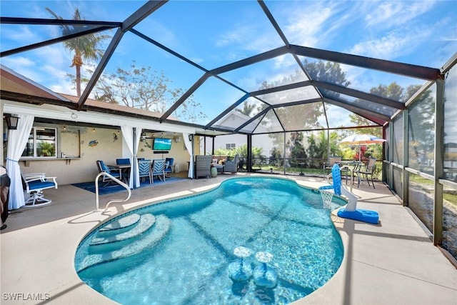 pool with a lanai and a patio