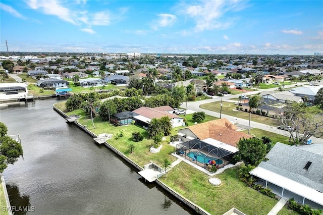 aerial view featuring a water view and a residential view