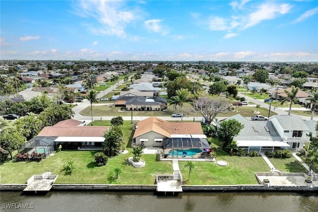 bird's eye view with a water view and a residential view