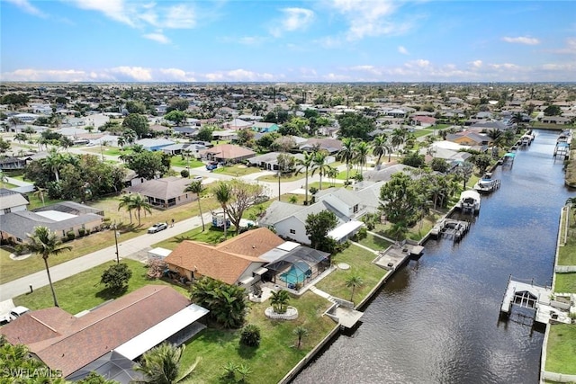 aerial view with a water view and a residential view