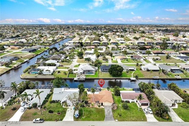 bird's eye view with a water view and a residential view