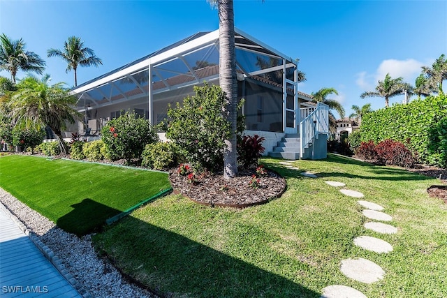 view of yard featuring a lanai