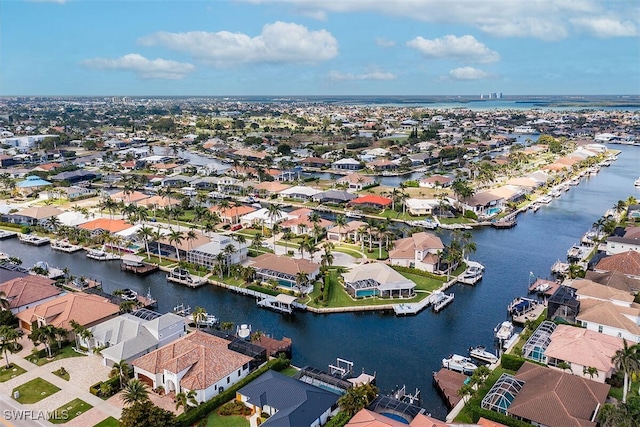 bird's eye view featuring a water view and a residential view