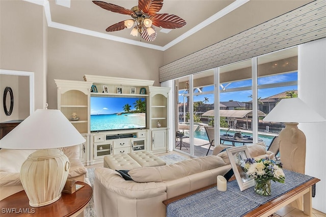 living room with ceiling fan and crown molding