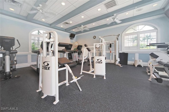 gym featuring a ceiling fan, visible vents, crown molding, and baseboards