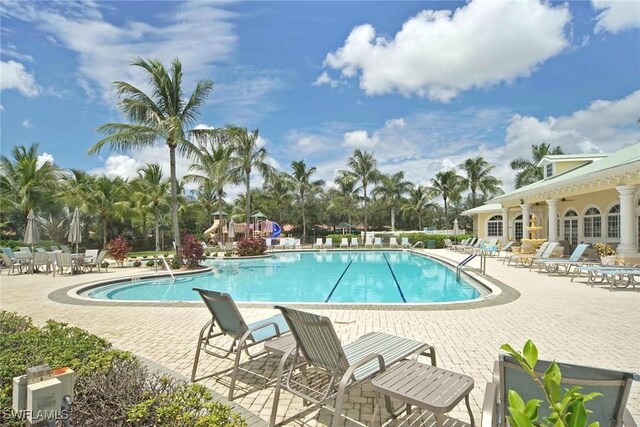 community pool with a patio area