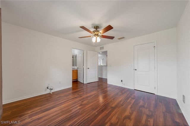 unfurnished bedroom with ceiling fan, dark wood finished floors, visible vents, and baseboards