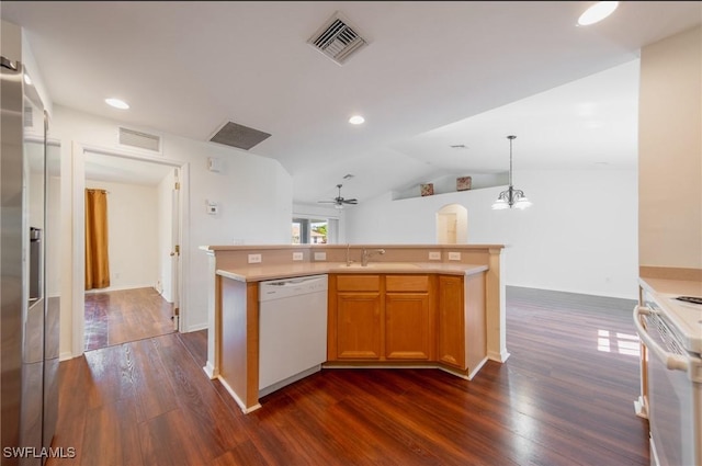 kitchen featuring dark wood-style floors, light countertops, white appliances, and visible vents