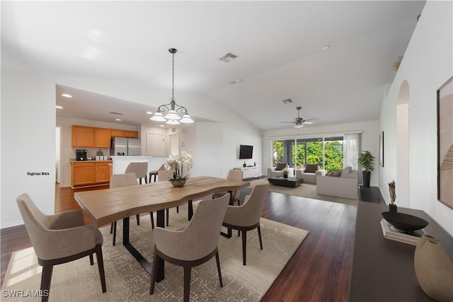 dining space featuring visible vents, wood finished floors, a ceiling fan, and vaulted ceiling