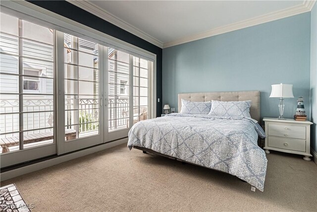 bedroom with carpet floors, access to exterior, and crown molding