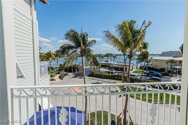 balcony featuring a water view