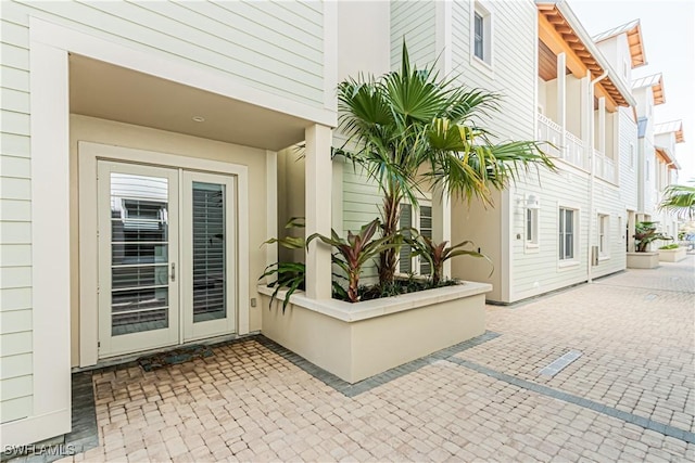 property entrance featuring a patio