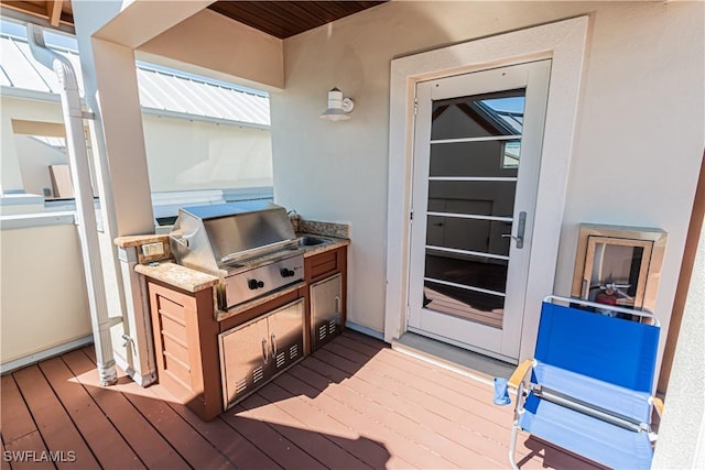 deck featuring a grill and area for grilling