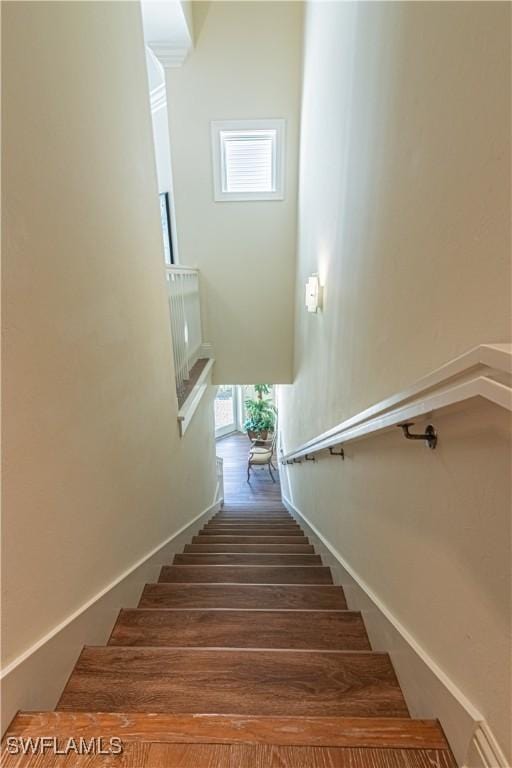 stairway featuring baseboards