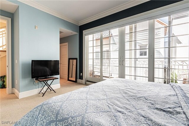 bedroom with carpet, ornamental molding, and baseboards