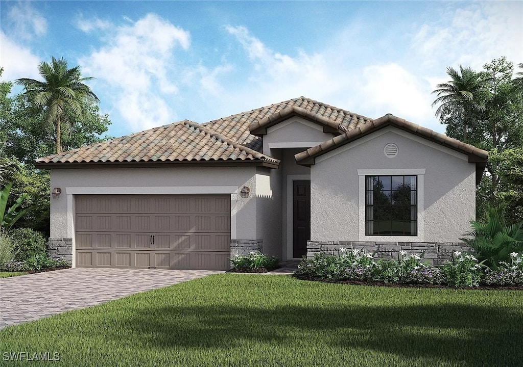 mediterranean / spanish home featuring an attached garage, stone siding, a tiled roof, decorative driveway, and stucco siding