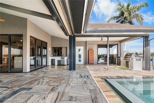 view of patio featuring an outdoor kitchen and area for grilling