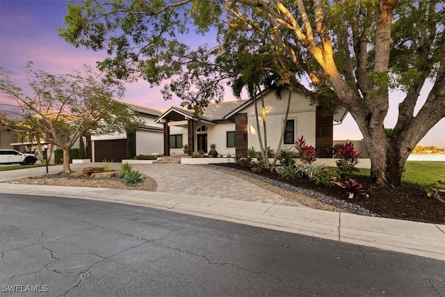 view of front of home with driveway and stucco siding