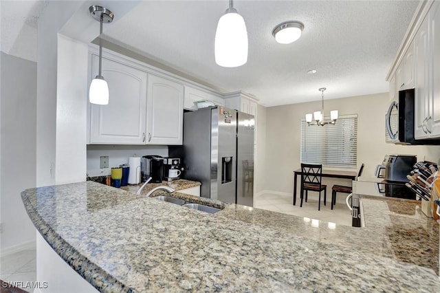 kitchen with a sink, range with electric stovetop, white cabinets, stainless steel fridge with ice dispenser, and light stone countertops