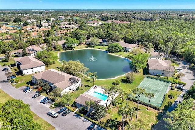 birds eye view of property with a residential view and a water view