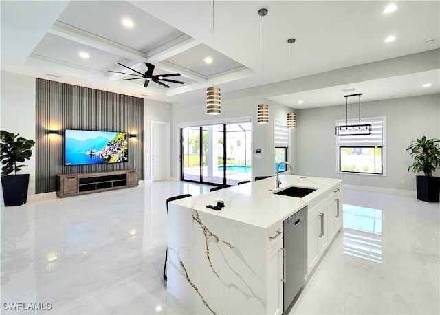 kitchen featuring coffered ceiling, dishwasher, open floor plan, marble finish floor, and a sink