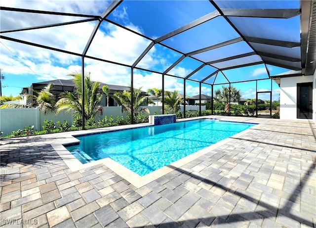 outdoor pool featuring a lanai and a patio