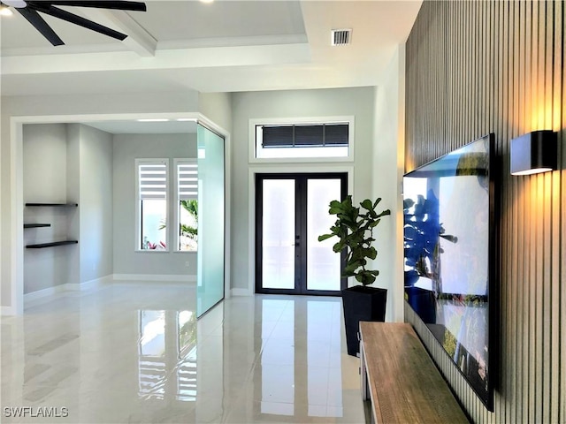 entrance foyer featuring french doors, visible vents, and baseboards