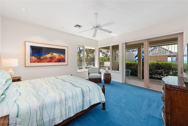 carpeted bedroom with visible vents, a sunroom, a ceiling fan, and access to outside