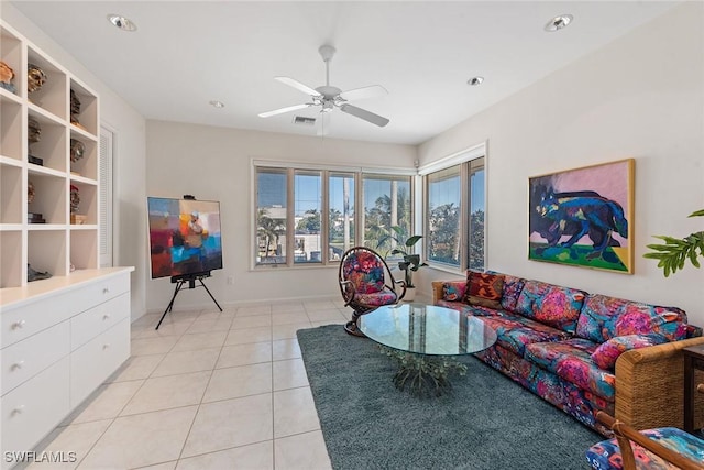 living room with light tile patterned floors, a ceiling fan, and visible vents