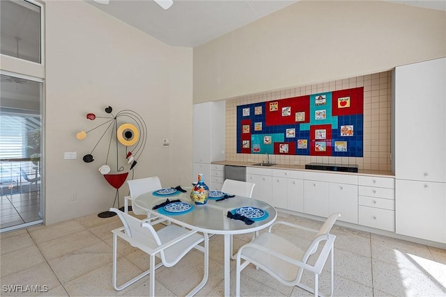 dining room with light speckled floor