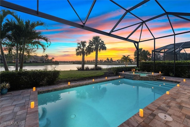 view of pool with a patio area, a lanai, a water view, and a pool with connected hot tub