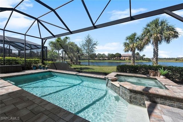 view of swimming pool featuring a patio area, a lanai, a water view, and a pool with connected hot tub