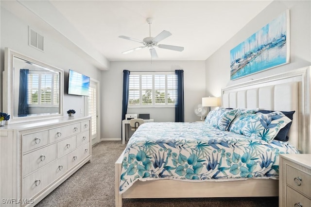 bedroom with light carpet, ceiling fan, and visible vents