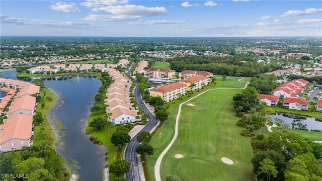 birds eye view of property featuring golf course view and a water view