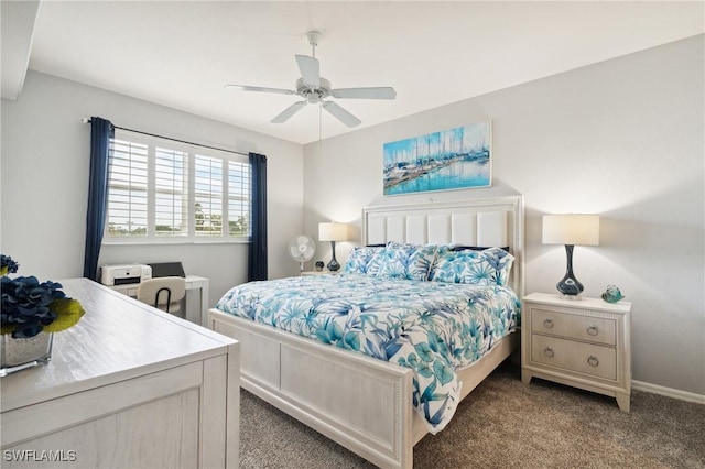 carpeted bedroom featuring baseboards and a ceiling fan