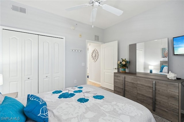 bedroom with a closet, visible vents, and a ceiling fan