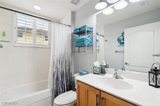 full bath featuring toilet, visible vents, shower / bath combination with curtain, and vanity