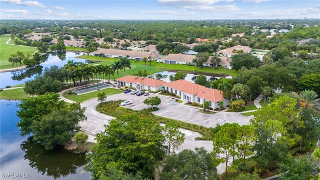 drone / aerial view with a water view and a residential view