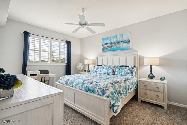 carpeted bedroom featuring a ceiling fan and baseboards