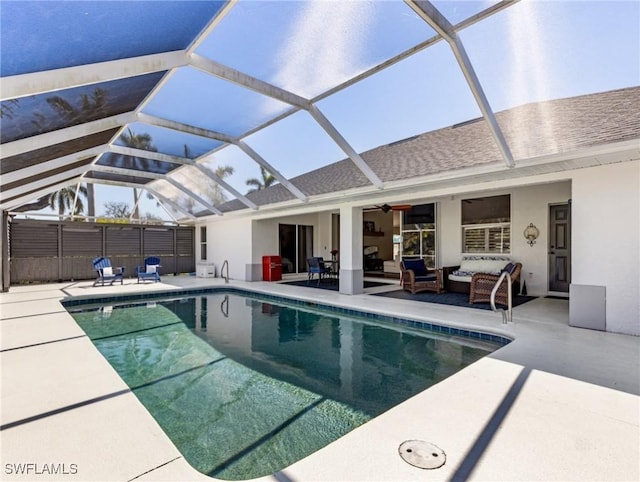 pool with a lanai, a patio area, and outdoor lounge area