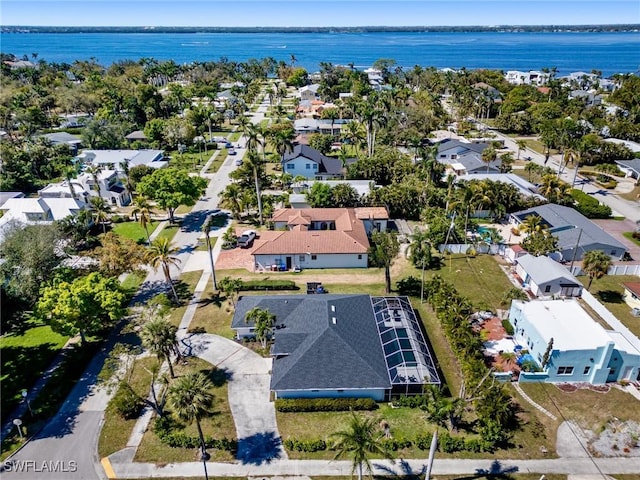 bird's eye view with a water view and a residential view