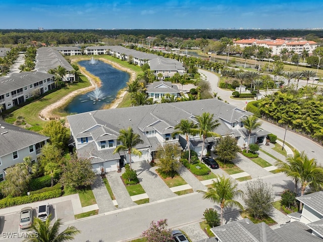 birds eye view of property featuring a residential view and a water view