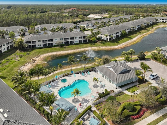 birds eye view of property featuring a residential view and a water view