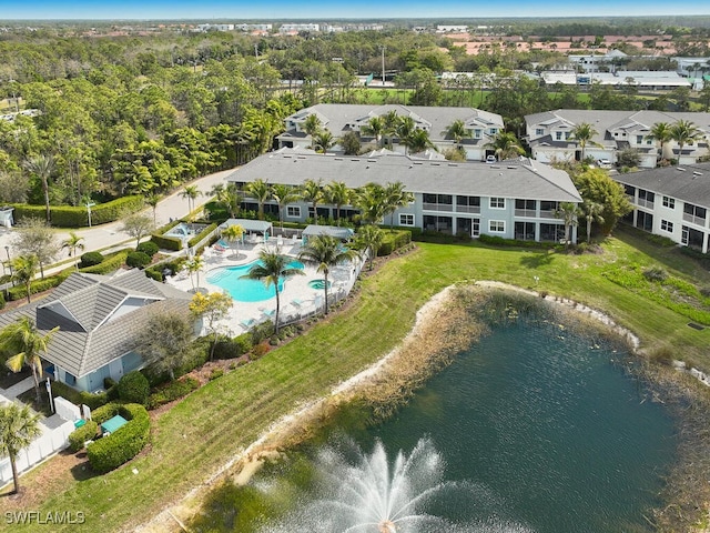 drone / aerial view featuring a residential view and a water view