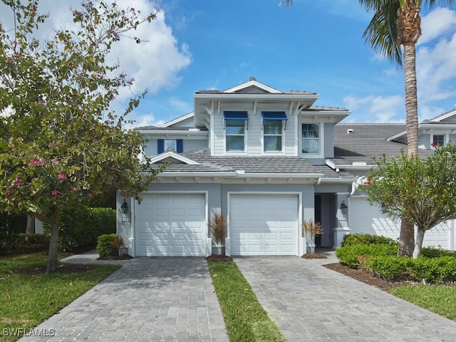 view of front of house featuring an attached garage and driveway